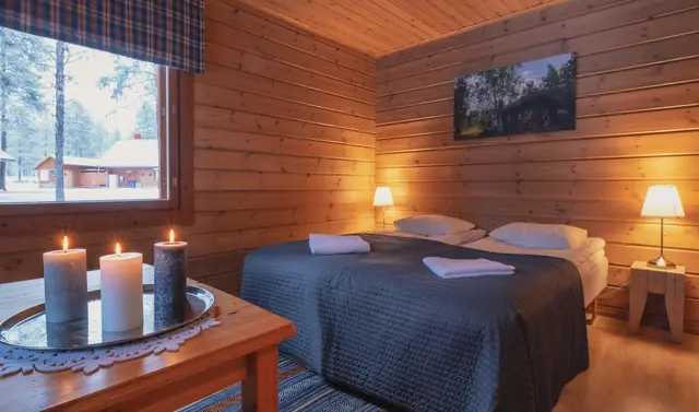 Hotel room at a Lapland resort with beds made up for a family stay