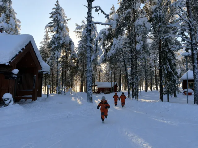 Snow covered walkway between buildings at a Lapland resort