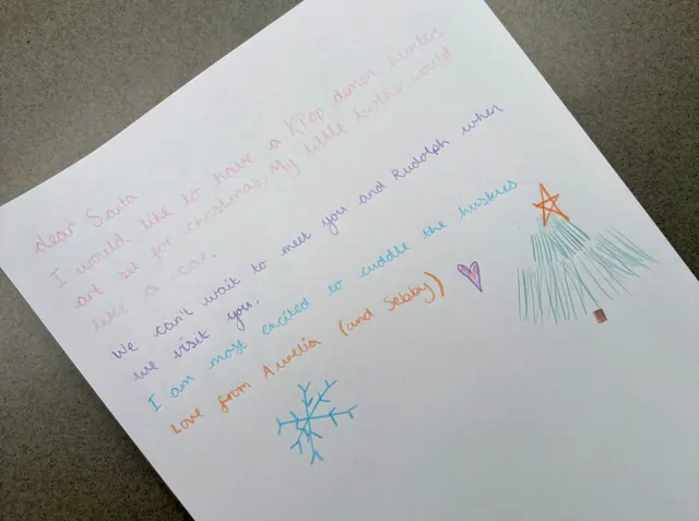 A handwritten letter to Santa from Amelie and Sebby, excited about huskies